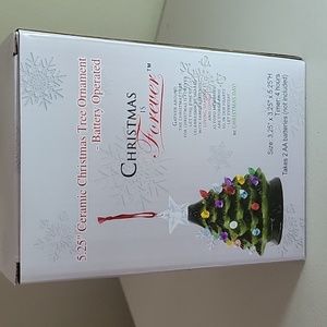 Brand new in a box Christmas is forever ornament which it is a christmas tree.